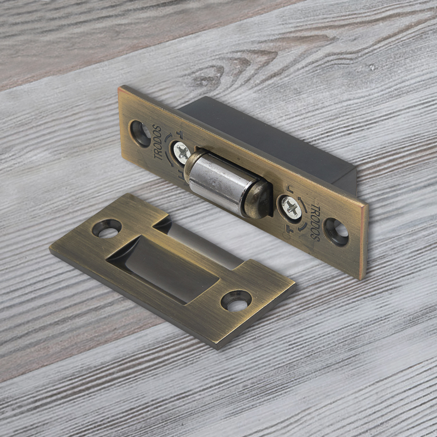 Фиксатор дверной Trodos роликовый, бронза